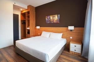 Giường trong phòng chung tại Hotspring 2 Room Premium 1510 Suite Sunway Onsen Theme Park View, 5pax