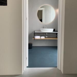 a bathroom with a sink and a mirror at Donna Caterina in Monopoli