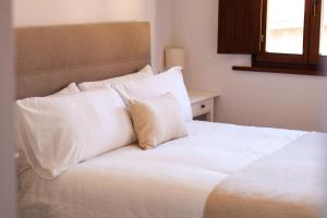 Postel nebo postele na pokoji v ubytování LAGO Home - Apartamento nuevo en Llanes centro