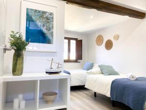 Postel nebo postele na pokoji v ubytování LAGO Home - Apartamento nuevo en Llanes centro