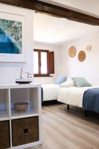 Postel nebo postele na pokoji v ubytování LAGO Home - Apartamento nuevo en Llanes centro