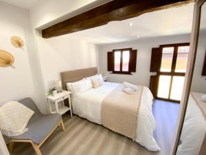 Postel nebo postele na pokoji v ubytování LAGO Home - Apartamento nuevo en Llanes centro
