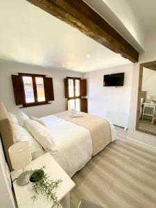 Postel nebo postele na pokoji v ubytování LAGO Home - Apartamento nuevo en Llanes centro