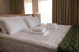 Postel nebo postele na pokoji v ubytování HOTEL GRACIAN