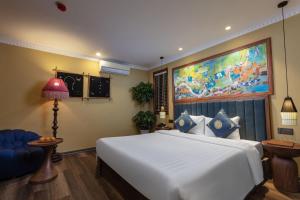 Postel nebo postele na pokoji v ubytování HOTEL DE SAPA