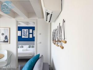 a living room with a couch and a bed at San Rocco Sweet Apartments in Muggia +166 photos