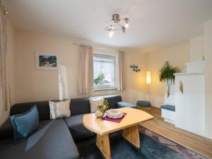 a living room with a couch and a table at Haus Eberharter in Mayrhofen