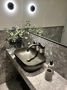 a bathroom with a sink in a counter at Casa Papagayo in Cordoba