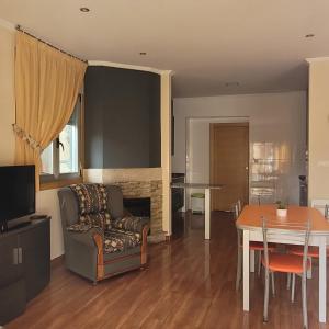a living room with a couch and a table at Casa Maside Orense in Maside
