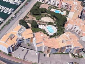 an aerial view of a building with a pool at Studio - résidence avec piscine in Cap d'Agde +3 photos