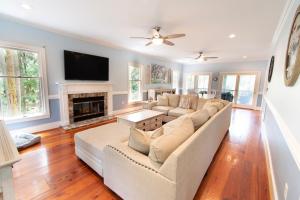 a living room with a couch and a fireplace at 3236 Middle Dam Court in Johns Island