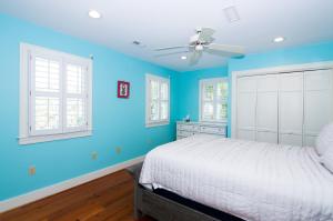 a blue bedroom with a bed and two windows at 3236 Middle Dam Court in Johns Island +35 photos