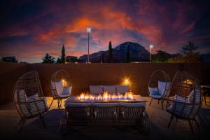 a group of chairs and a table with lit candles at GreenTree Inn Sedona in Sedona +65 photos