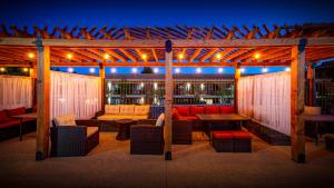 a gazebo with a couch and a table and chairs at GreenTree Inn Sedona in Sedona