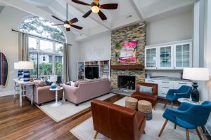 a living room with a couch and a fireplace at 2251 Catesby's Bluff in Seabrook Island