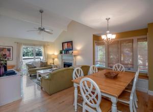 a dining room and living room with a table and chairs at 1248 Creekwatch Villa in Seabrook Island