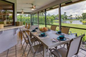 a dining room with a table and chairs on a patio at Pet-Friendly Wellington Vacation Rental on Canal! in Wellington