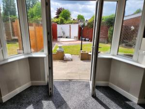 a view of a room with a door open at Sheldon Shared House in Birmingham