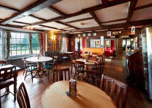 a restaurant with tables and chairs in a room at Camden Arms Hotel in Royal Tunbridge Wells