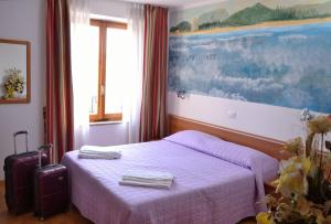 Letto o letti in una camera di Sale Hotel