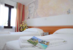 Letto o letti in una camera di Sale Hotel