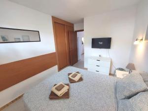 Łóżko lub łóżka w pokoju w obiekcie Sun apartment Antigua