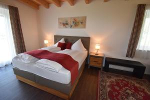 Postel nebo postele na pokoji v ubytování Hotel Martina