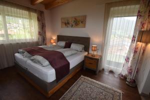 Postel nebo postele na pokoji v ubytování Hotel Martina