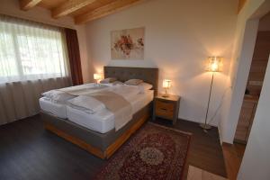 Postel nebo postele na pokoji v ubytování Hotel Martina