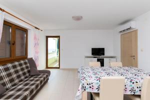 TV a/nebo společenská místnost v ubytování Apartments Mario