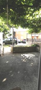 a view of a parking lot with cars parked at Sobe i apartmani Marović in Petrovac na Moru