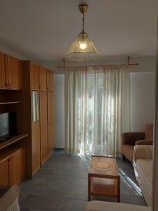 a living room with a couch and a table at Mala placa in Senj