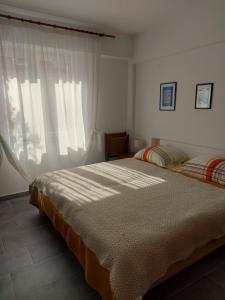 a bedroom with two beds and a window at Mala placa in Senj