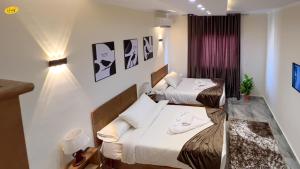 Ένα ή περισσότερα κρεβάτια σε δωμάτιο στο Happy View Inn