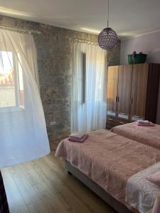 Posteľ alebo postele v izbe v ubytovaní Devivi Apartments