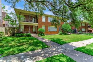 a large brick house with a green yard at Med Center Duplex Pool Hot Tub 1 mi 2 NRG 2100 sf in Houston