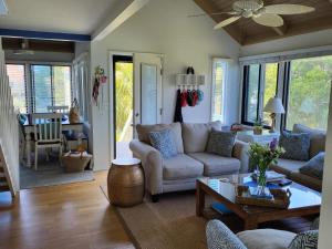 a living room with a couch and a table at 915 Sealoft Villa in Seabrook Island