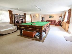 a living room with a pool table in it at Llys Offa in Wynnstay