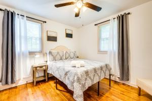 a bedroom with a bed and a ceiling fan at Atlanta Vacation Rental Less Than 10 Mi to Downtown! in Atlanta