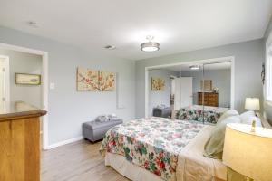 a bedroom with a bed and a mirror at Cozy Shenandoah Home Less Than 2 Mi to The Woodlands Mall! in The Woodlands