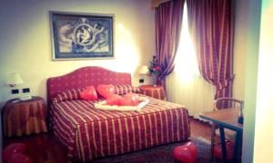 Posteľ alebo postele v izbe v ubytovaní Hotel Luna