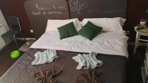 Posteľ alebo postele v izbe v ubytovaní Casa de Huéspedes con encanto El Sueño del Quijote