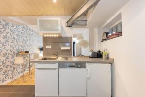 a kitchen with a sink and a counter top at FerienNest Bad Ems, Appartment RankenNest in Bad Ems