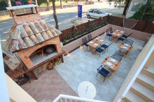 an overhead view of a patio with a pizza oven at Apartments Katušić in Cavtat