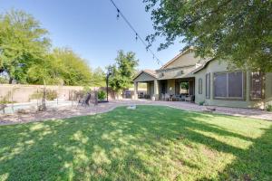 a house with a yard with a yard at Sunny V Arizona Retreat with Private Pool and Patio in Surprise