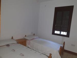 Postel nebo postele na pokoji v ubytování Villa el Mirador