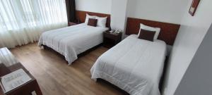 Postel nebo postele na pokoji v ubytování Faraona Grand Hotel