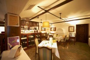 a dining room with tables and chairs in a restaurant at Apparthotel Restaurant Steiners in Eben im Pongau