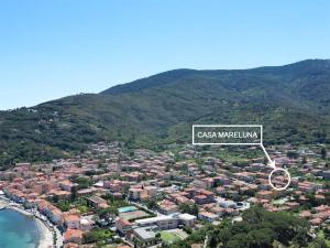 a sign that reads cassica marina in front of a city at Casa Mareluna - ArgonautiVacanze in Marciana Marina