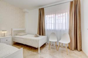 Postel nebo postele na pokoji v ubytování Casa del Sol